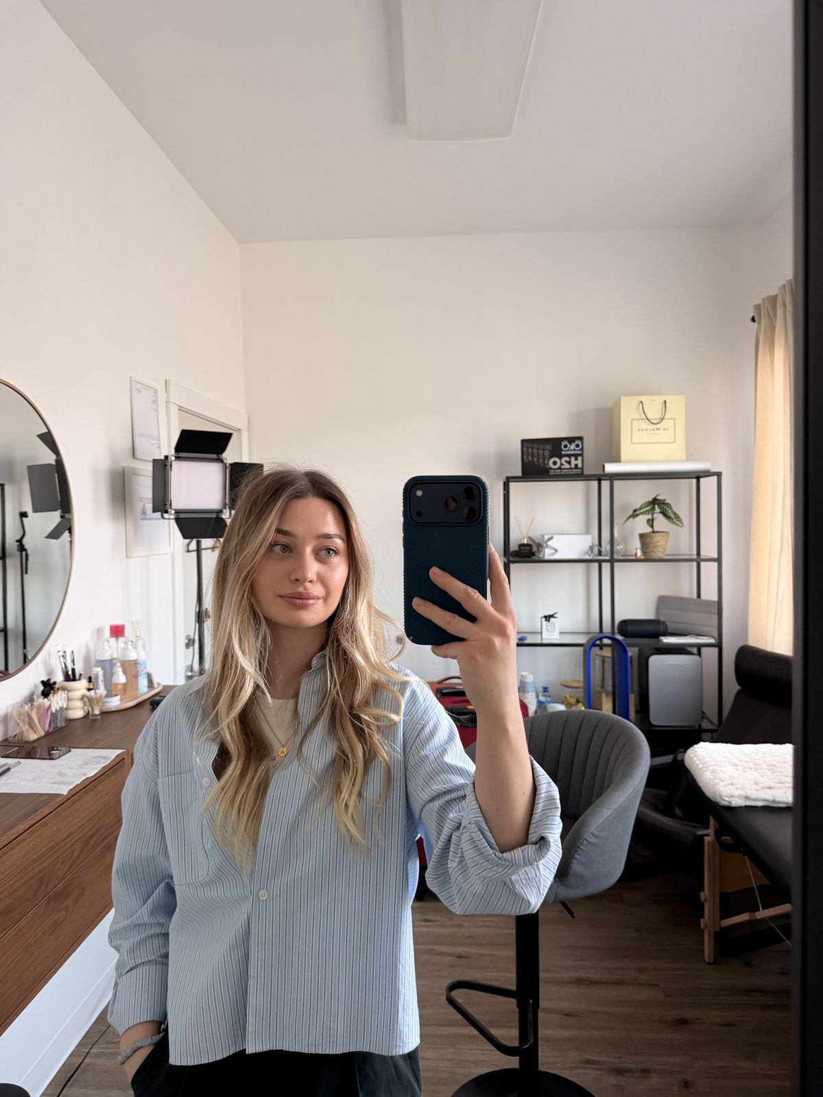 Inside the Allum Beauty studio in West Seattle — vanity, ring light, lash bed and treatment chair